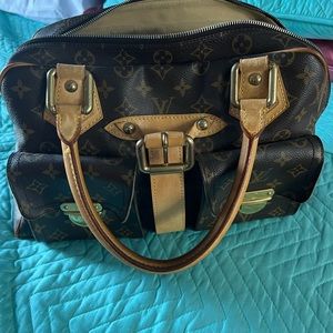 Cartera Louis Vuitton tamaño regular buen uso no rota ni pelada